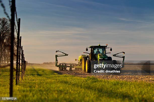 planting corn in evening light in central illinois - midwest usa stock pictures, royalty-free photos & images