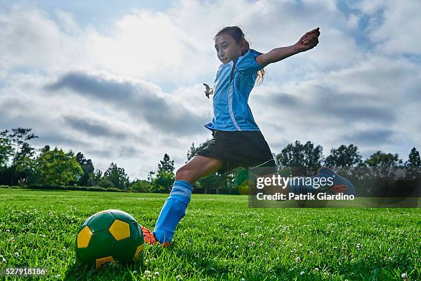 kids playing soccer - kicking goal stock pictures, royalty-free photos & images