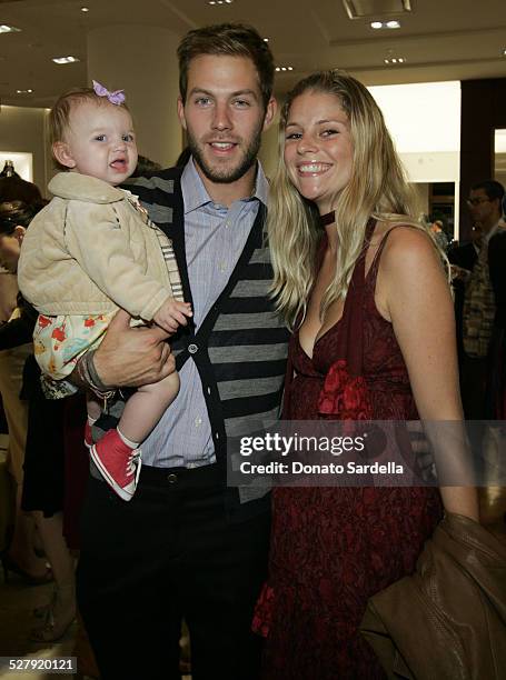 Julies and Johnny with daughter London during Burberry Hosts The Snippy World of New Yorker Fashion Artist Michael Roberts Book Signing - November 2,...