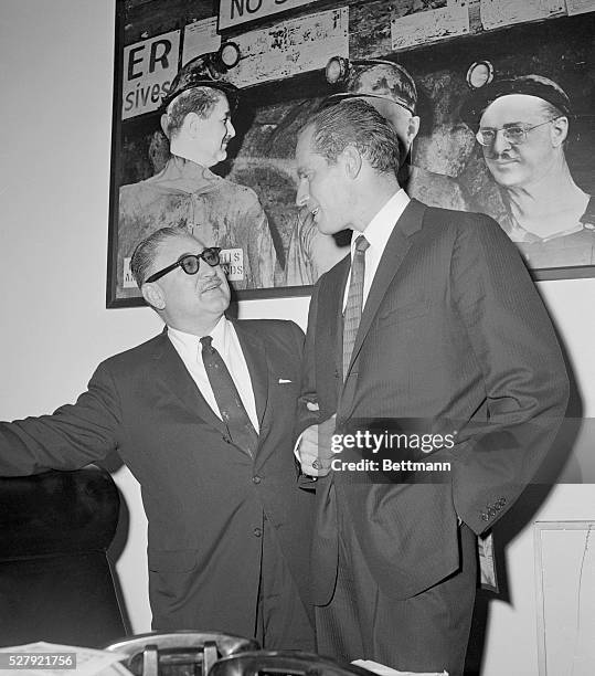 Washington: Heston Testifies. Charlton Heston, actor and vice president of the Screen Actors' Guild, confers with Rep. John H. Dent , chairman of the...