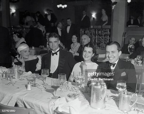 Left to right: Miss Eleanor Holm; Howard Hughes, millionaire film producer and aviator; Sandra Shaw; and Carl Laemmle, Jr. Miss Holm is shown wearing...