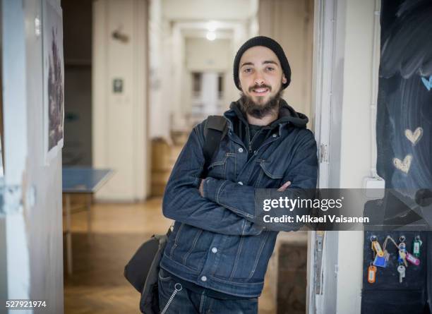 art school student in doorway - male artist stock pictures, royalty-free photos & images