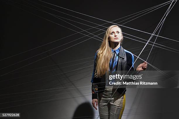 String Thread Hanging 73 Woman Hanging On By Thread Stock Photos, High-Res Pictures, and ...