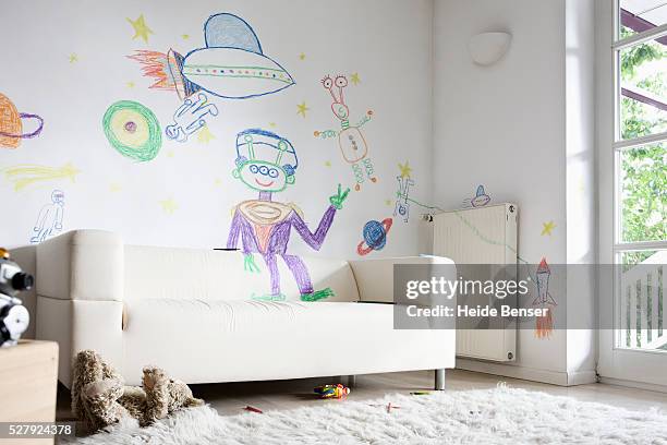 child's drawings on wall in living room - chalk wall stock pictures, royalty-free photos & images