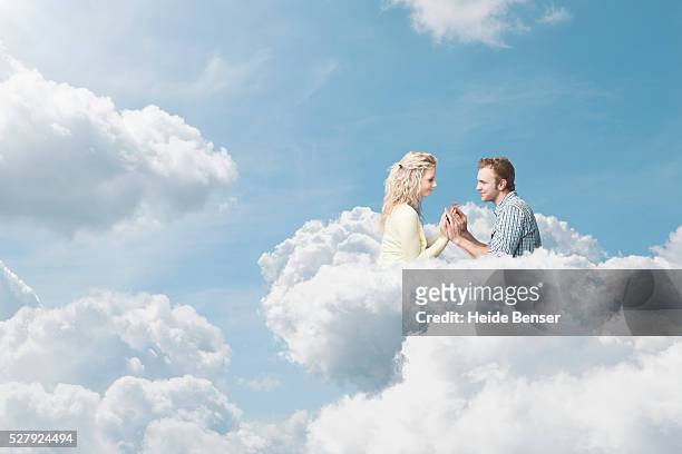 couple in clouds, digital composite - ideal wife stock pictures, royalty-free photos & images