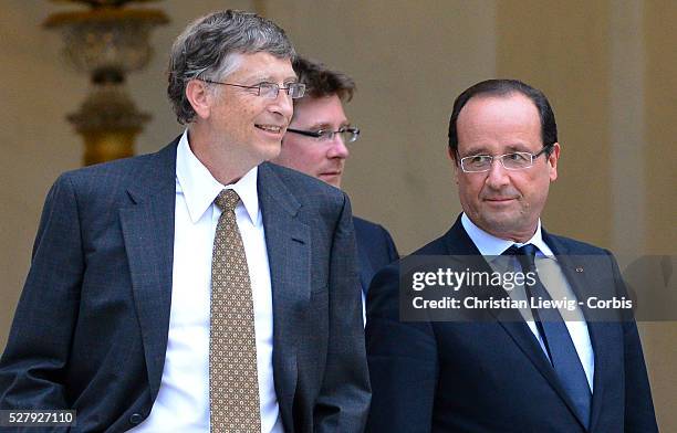 French President Francois Hollande welcomes Irish musician and humanitarian activist Bono and Microsoft co-founder turned global philanthropist Bill...