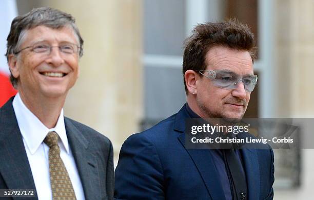 French President Francois Hollande welcomes Irish musician and humanitarian activist Bono and Microsoft co-founder turned global philanthropist Bill...