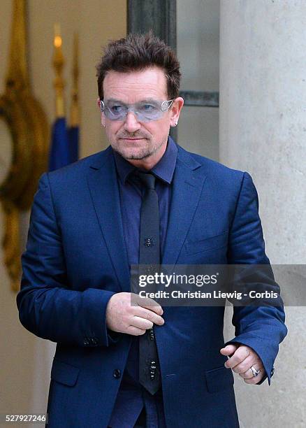 French President Francois Hollande welcomes Irish musician and humanitarian activist Bono and Microsoft co-founder turned global philanthropist Bill...