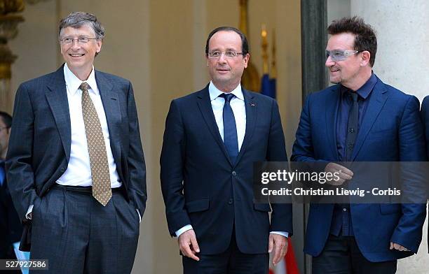 French President Francois Hollande welcomes Irish musician and humanitarian activist Bono and Microsoft co-founder turned global philanthropist Bill...