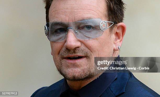 French President Francois Hollande welcomes Irish musician and humanitarian activist Bono and Microsoft co-founder turned global philanthropist Bill...