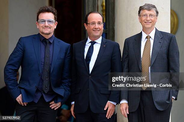 French President Francois Hollande welcomes Irish musician and humanitarian activist Bono and Microsoft co-founder turned global philanthropist Bill...