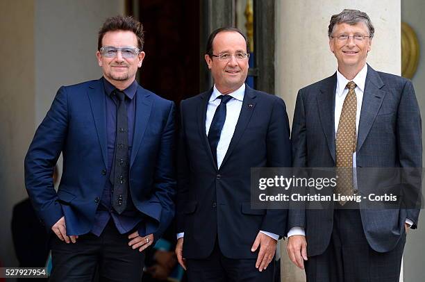 French President Francois Hollande welcomes Irish musician and humanitarian activist Bono and Microsoft co-founder turned global philanthropist Bill...