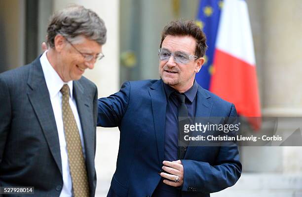 French President Francois Hollande welcomes Irish musician and humanitarian activist Bono and Microsoft co-founder turned global philanthropist Bill...