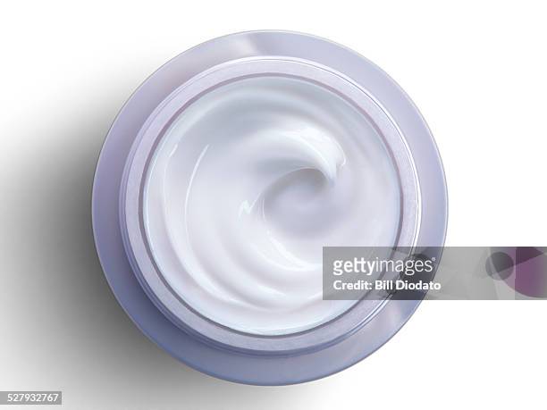 bottle of cream on white - creme stock-fotos und bilder