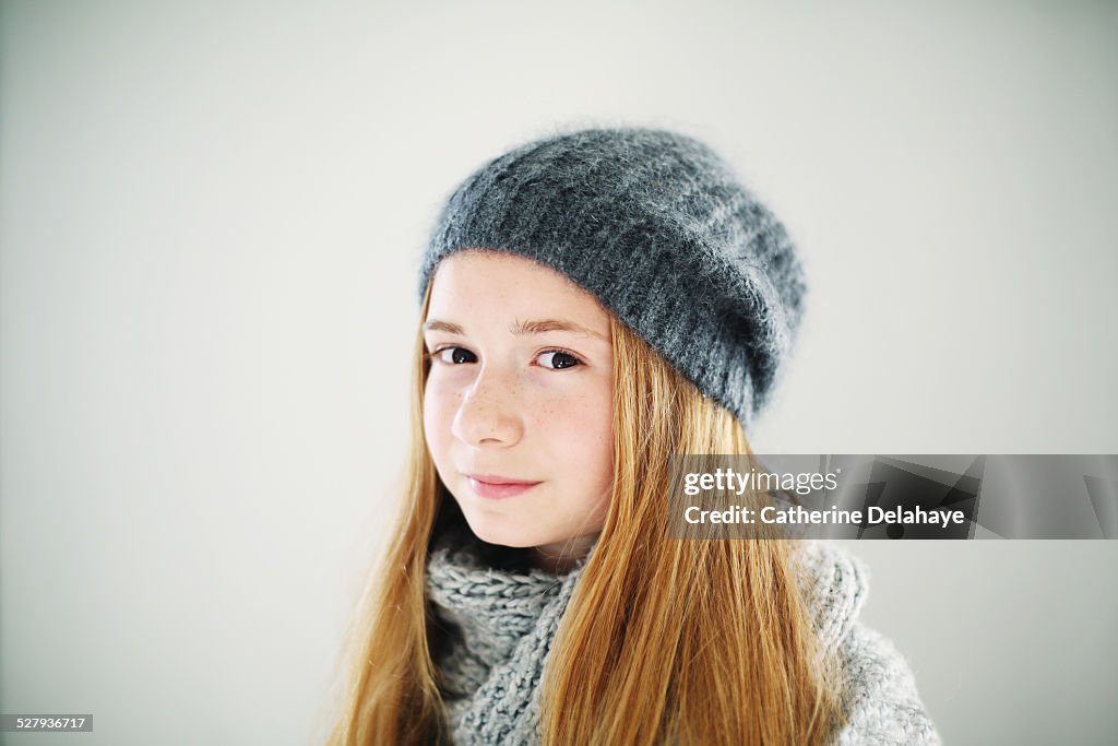 A teenager girl wearing a hat