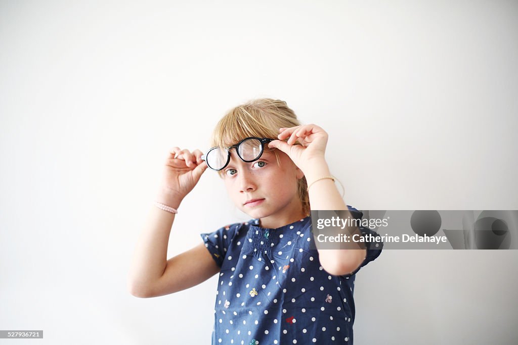 A 8 years old girl with glasses