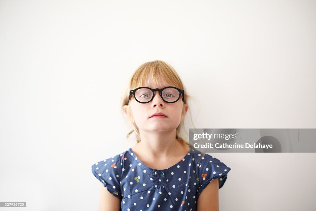 A 8 years old girl with glasses