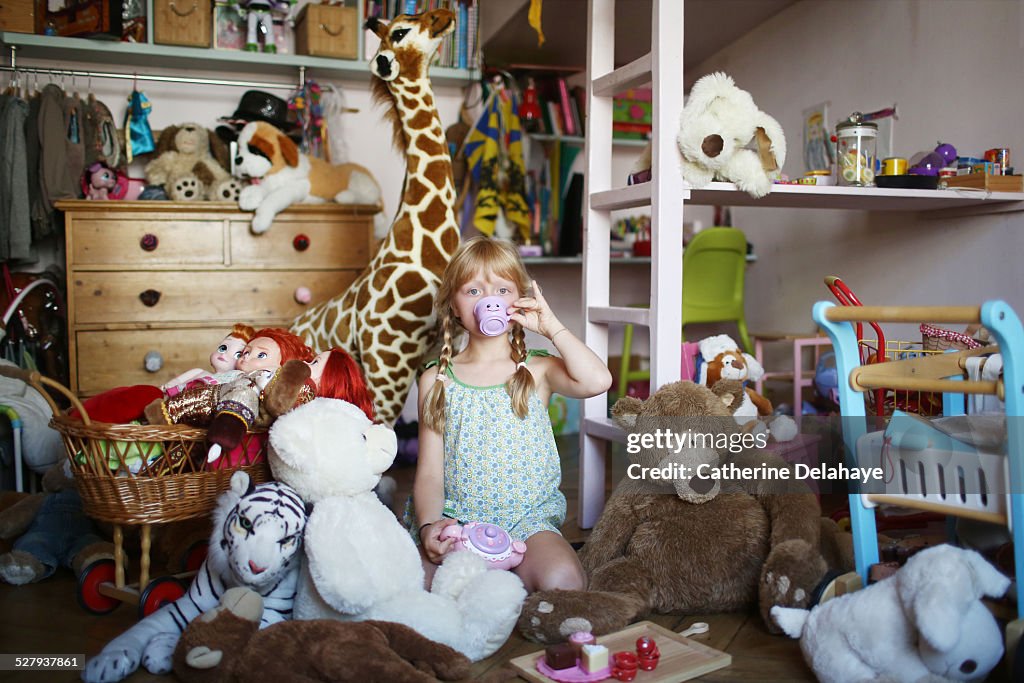 A girl in her filled bedroom
