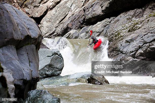 young man kayaking on white water - kayaking rapids stock pictures, royalty-free photos & images