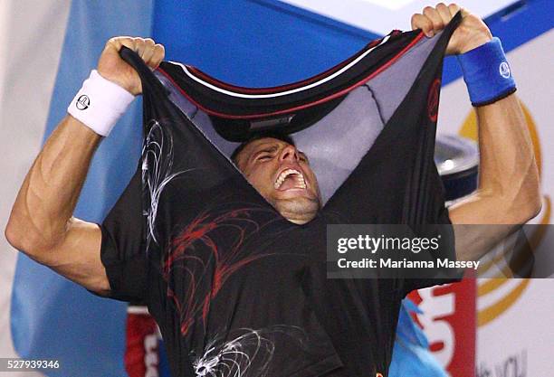 Novak Djokovic of Serbia celebrates winning championship point in his men's final match against Rafael Nadal of Spain during day fourteen of the 2012...