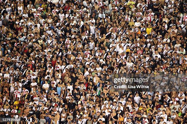 Flamengo fans supporting their team, waving flags and singing during the Flamengo v Vasco da Gama, Futebol Brasileirao 2010 League match at the...