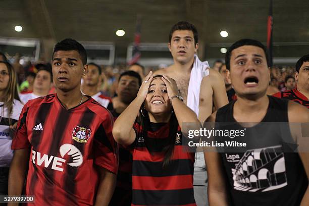 Flamengo fans supporting their team, waving flags and singing during the Flamengo v Vasco da Gama, Futebol Brasileirao 2010 League match at the...