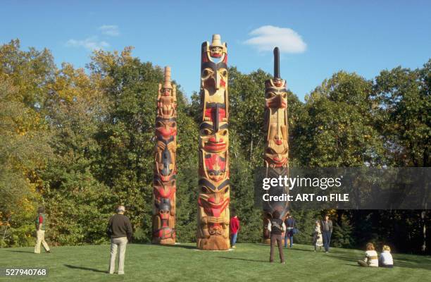 trio of totem poles by robert davidson - haida totem stock pictures, royalty-free photos & images