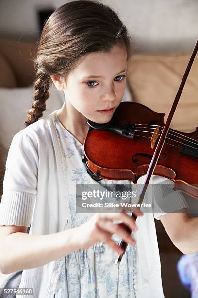 portrait of a pre-teen (10-11) girl playing violin - young violinist stock pictures, royalty-free photos & images