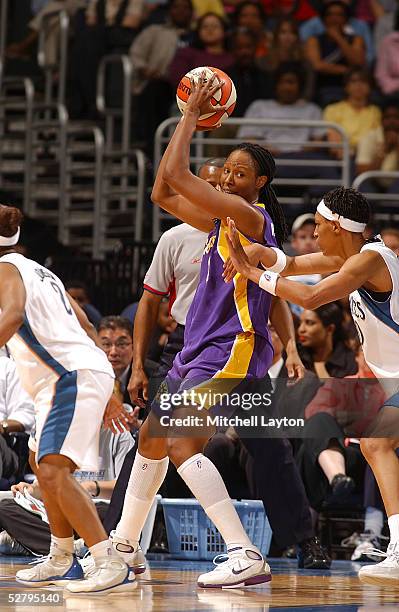 Chamique Holdsclaw of the Los Angeles Sparks trys to drive to the basket against the Washington Mystics in a WNBA exhibition game on May 10, 2005 at...