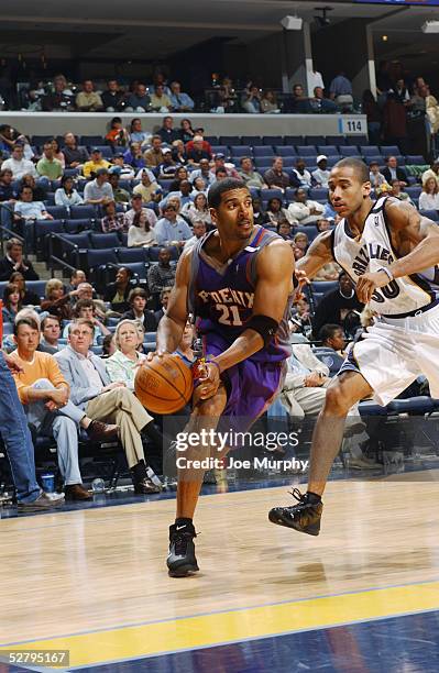 Jim Jackson of the Phoenix Suns drives to the basket against Dahntay Jones of the Memphis Grizzlies in Game three of the Western Conference...