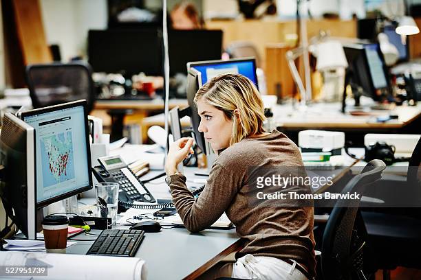 female architect on the phone with client - white collar worker stock pictures, royalty-free photos & images