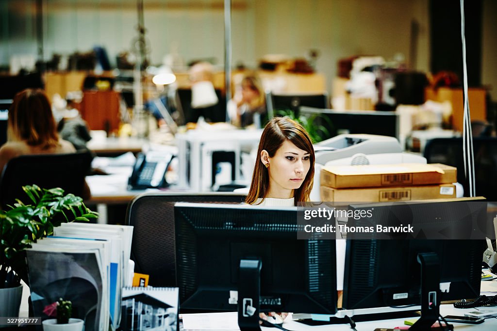 Businesswoman working on project on computer