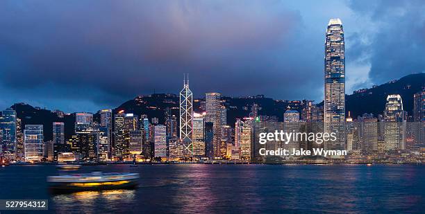 hong kong skyline and harbor as seen from kowloon - hong kong stock pictures, royalty-free photos & images