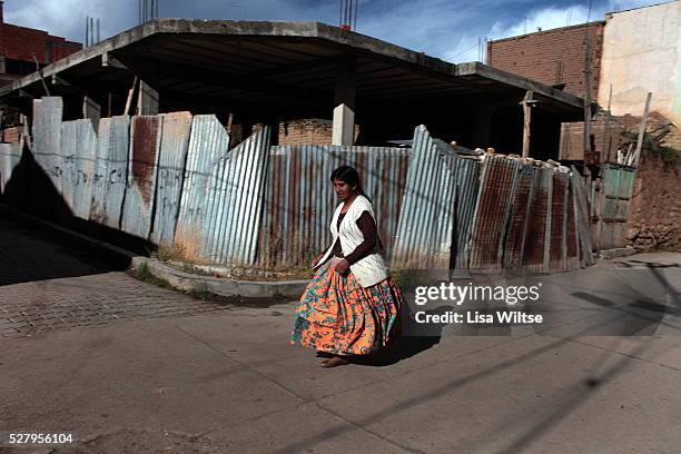 Virgen de la Candelaria A young woman runs through the streets of Copacabana during the Fiesta de la Virgen de la Candelaria is held to honour the...