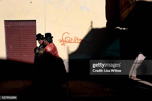 Virgen de la Candelaria. Women wearing colorful dresses in the streets if Copacabana during the Fiesta de la Virgen de la Candelaria is held to...