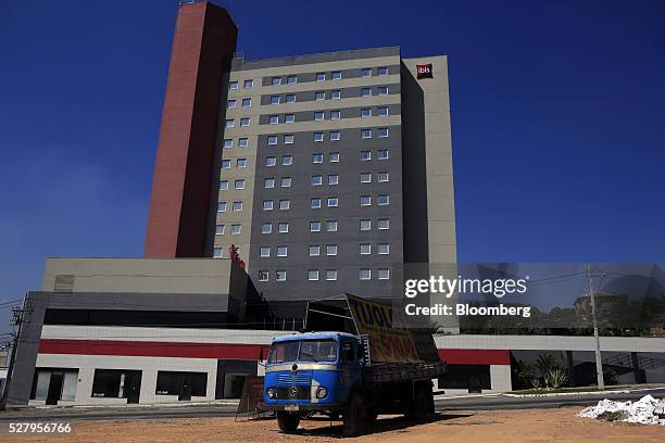 Truck selling bricks sits parked in front of the newly-built Ibis Hotel in Itaborai, Brazil, on Tuesday, April 12, 2016. Just 30 miles east of the...