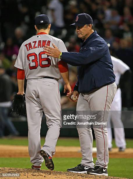Manager John Farrell of the Boston Red Sox takes Junichi Tazawa out of the game in the 8th inning against the Chicago White Sox at U.S. Cellular...