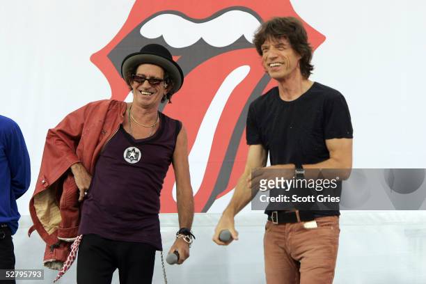 Mick Jagger and Keith Richards of The Rolling Stones talk to reporters during a press conference to announce a world tour at the Julliard Music...
