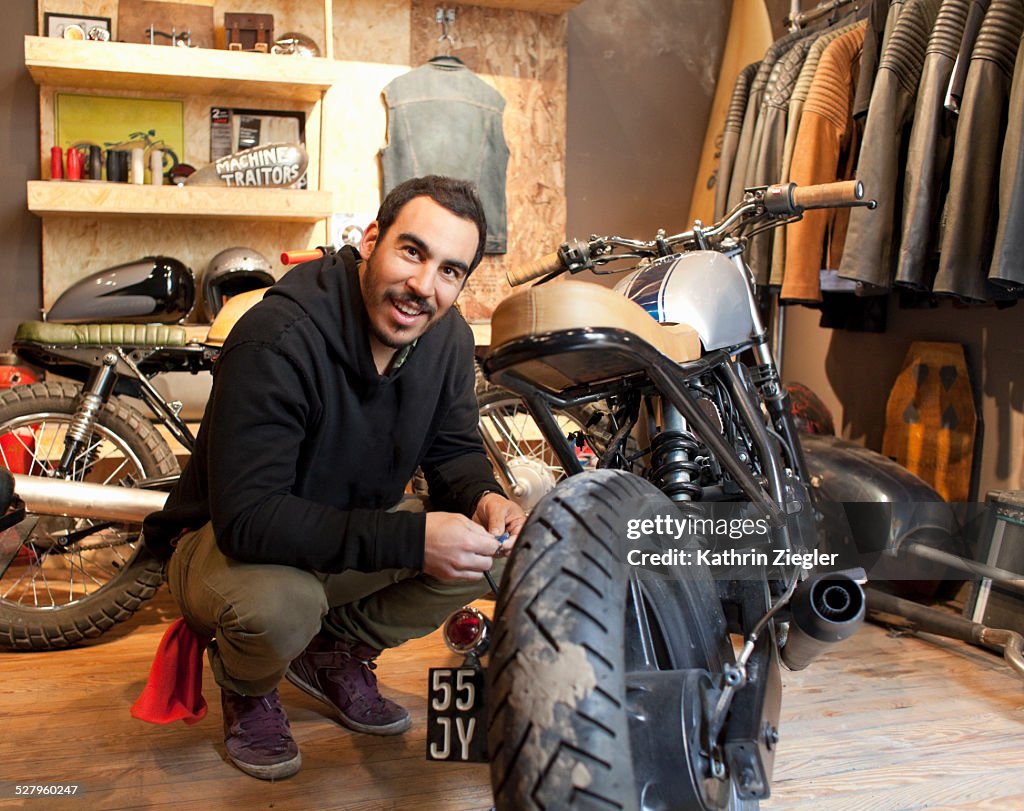 Motorcycle shop owner in his showroom