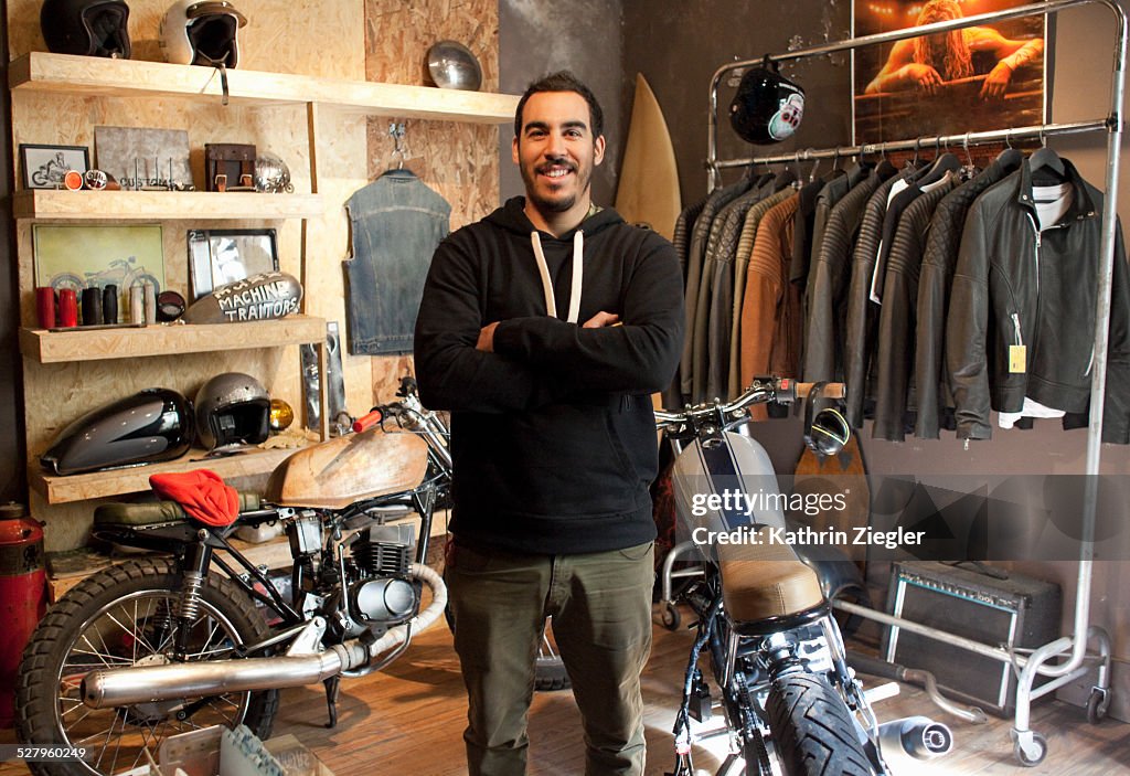 Motorcycle shop owner in his showroom