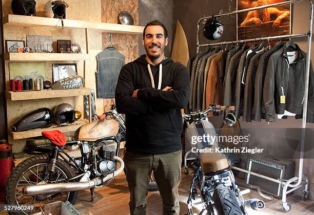 motorcycle shop owner in his showroom - motorbike shop stock pictures, royalty-free photos & images