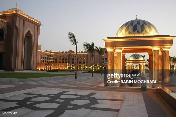 Night view of the Emirates Palace Hotel in Abu Dhabi 10 May 2005. Racing to catch up with bustling Dubai, the United Arab Emirates capital of Abu...