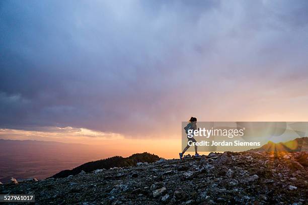 trail running at sunset - mountain woman ストックフォトと画像