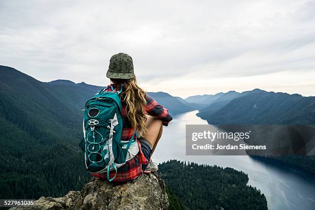 hiking to a scenic viewpoint. - backpack stock-fotos und bilder