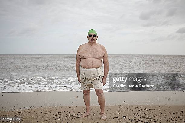 elderly gentleman ready to swim in the cold sea - barefoot men - fotografias e filmes do acervo