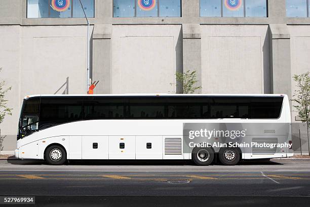 bus parked in front of building - bus front ストックフォトと画像