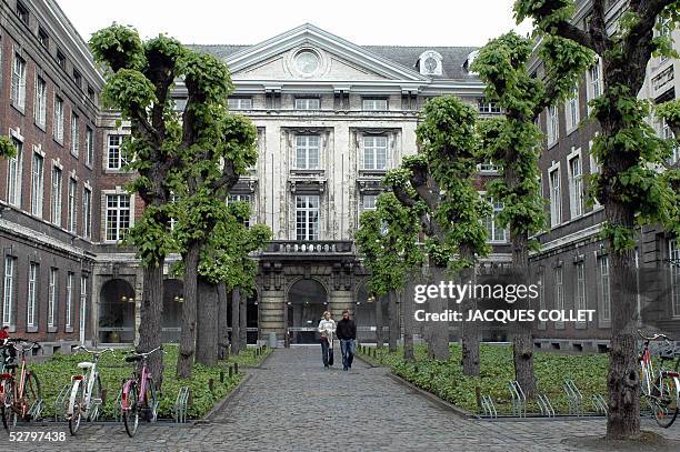 Picture taken 11 May 2005 at the University of Leuven, centre Belgium, shows students walking by a statue. A network of Chinese students coordinated...