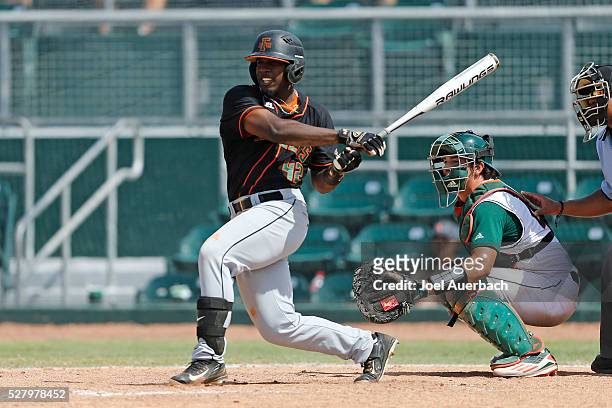 May 1: Marlon Gibbs of the Florida A&M Rattlers hits a double against the Miami Hurricanes during eighth inning action on May 1, 2016 at Alex...