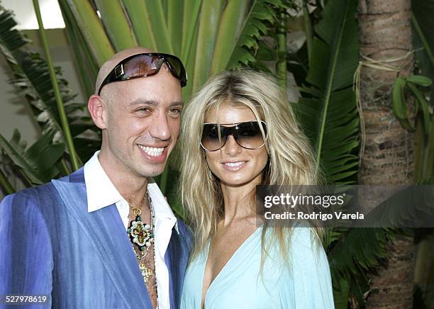 Robert Verdi in Chanel sunglasses with Marisa Miller in Vogue sunglasses