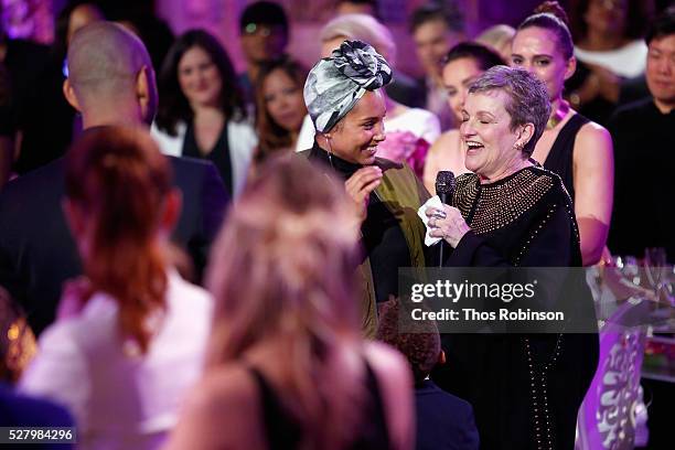 Singer-Songwriter Alicia Keys, , presents her mother, Terria Joseph, with a birthday cake at VH1's "Dear Mama" Event on May 3, 2016 in New York City....